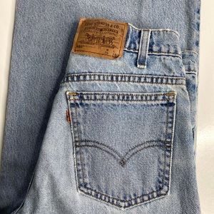 Vintage women’s orange tab Levi’s 550